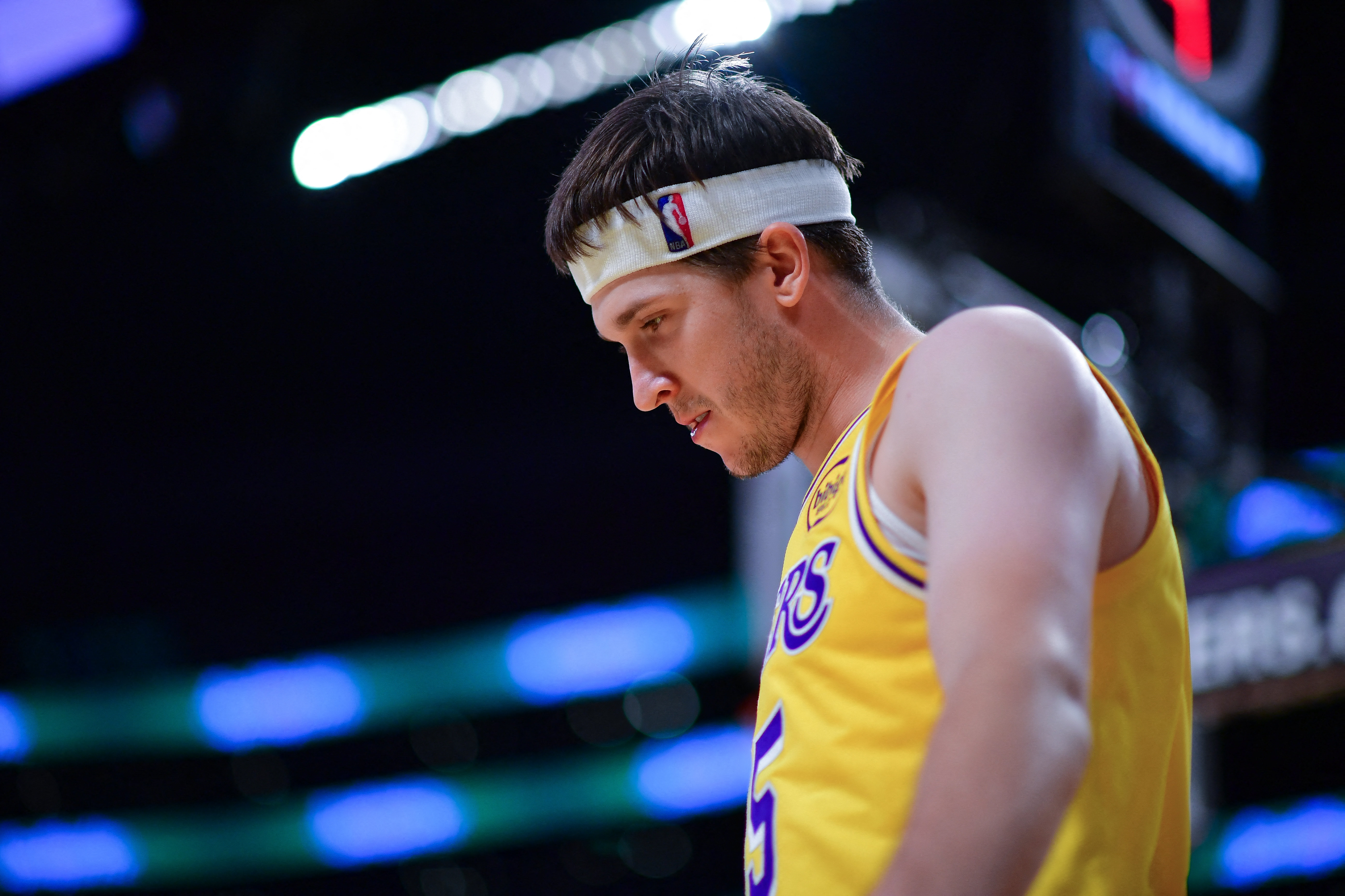 Los Angeles Lakers guard Austin Reaves (15), seen here looking on during a game, is featured in our NBA player props today.