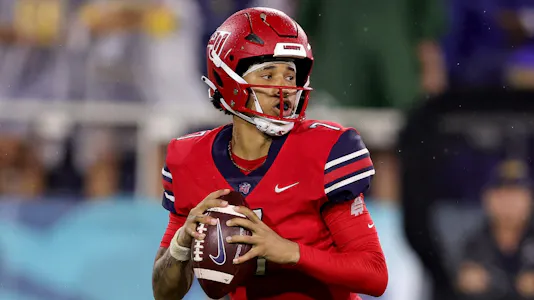 Kaidon Salter #7 of the Liberty Flames looks to pass against the Toledo Rockets as we make our New Mexico State vs. Liberty picks and predictions for the Conference USA Championship.