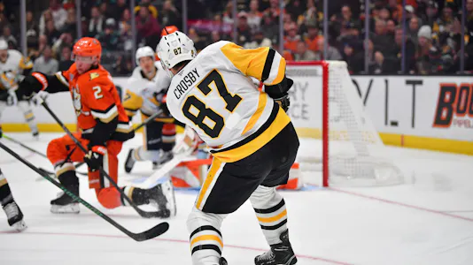 Sidney Crosby, featured in the Blues vs. Penguins Player Props, shoots on goal against the Anaheim Ducks.