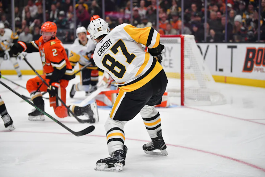 Sidney Crosby, featured in the Blues vs. Penguins Player Props, shoots on goal against the Anaheim Ducks.