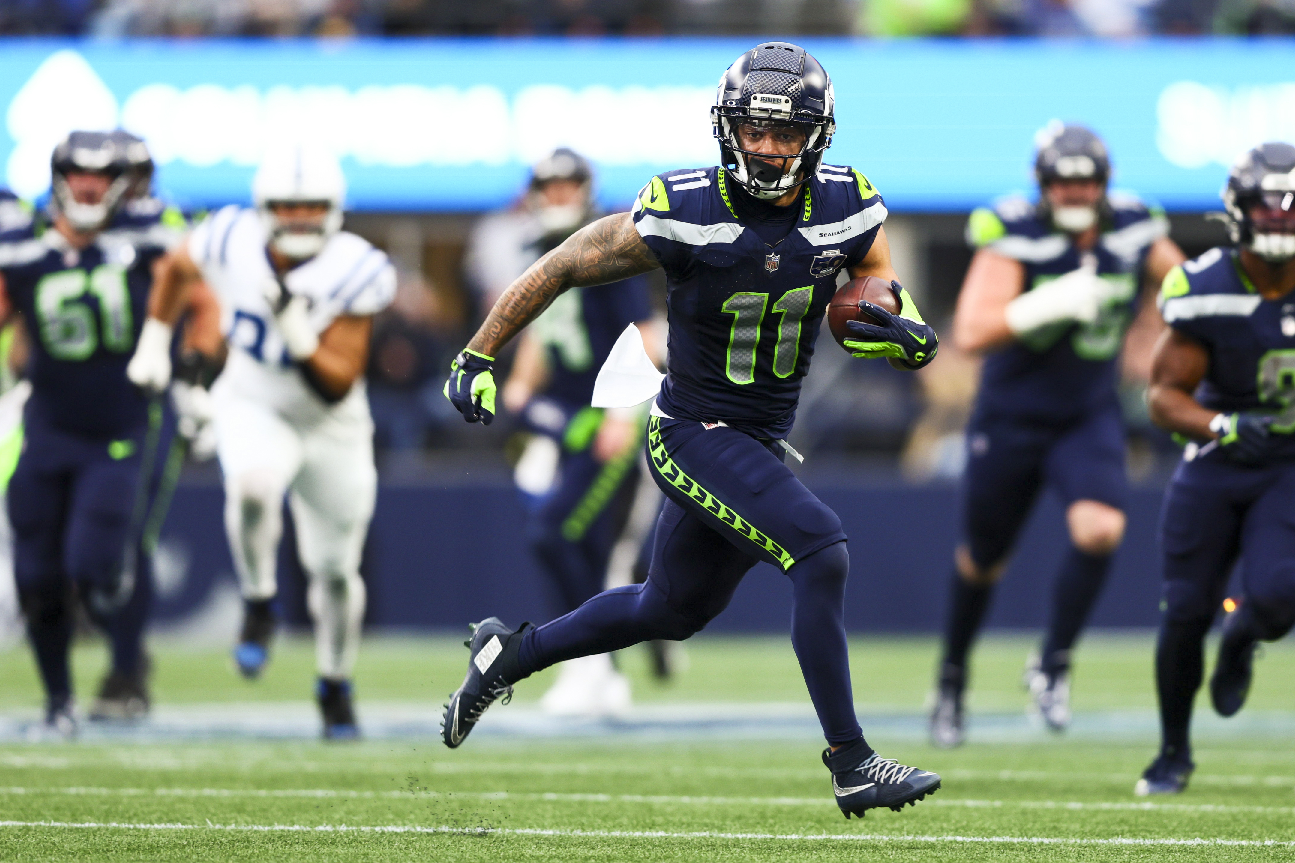 Seattle Seahawks wide receiver Jaxon Smith-Njigba (11) runs for yards as we break down our Seahawks vs. 49ers player props.