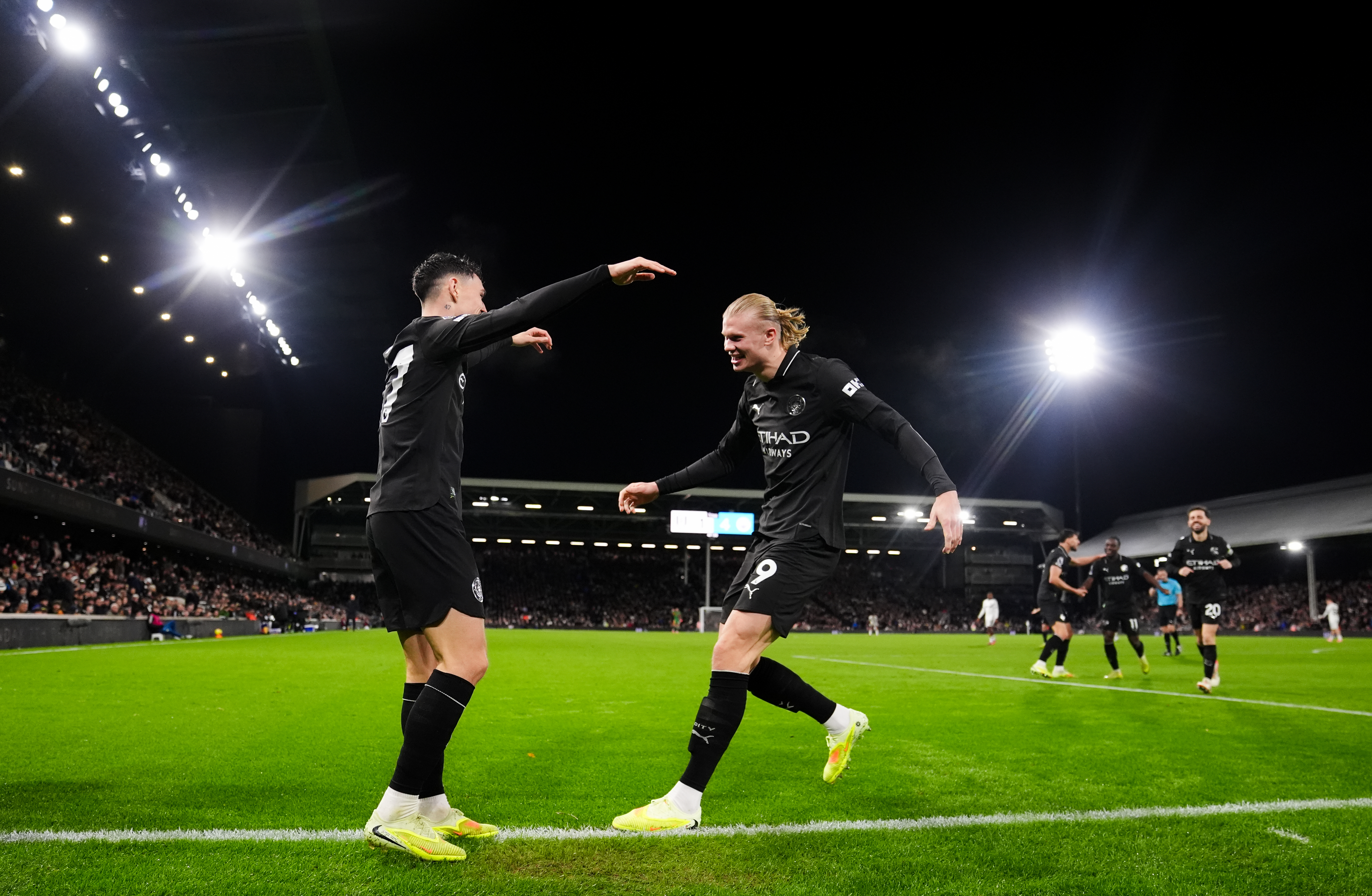 Manchester City's Phil Foden celebrates with Erling Haaland as we make our best Man City vs. Sunderland prediction.