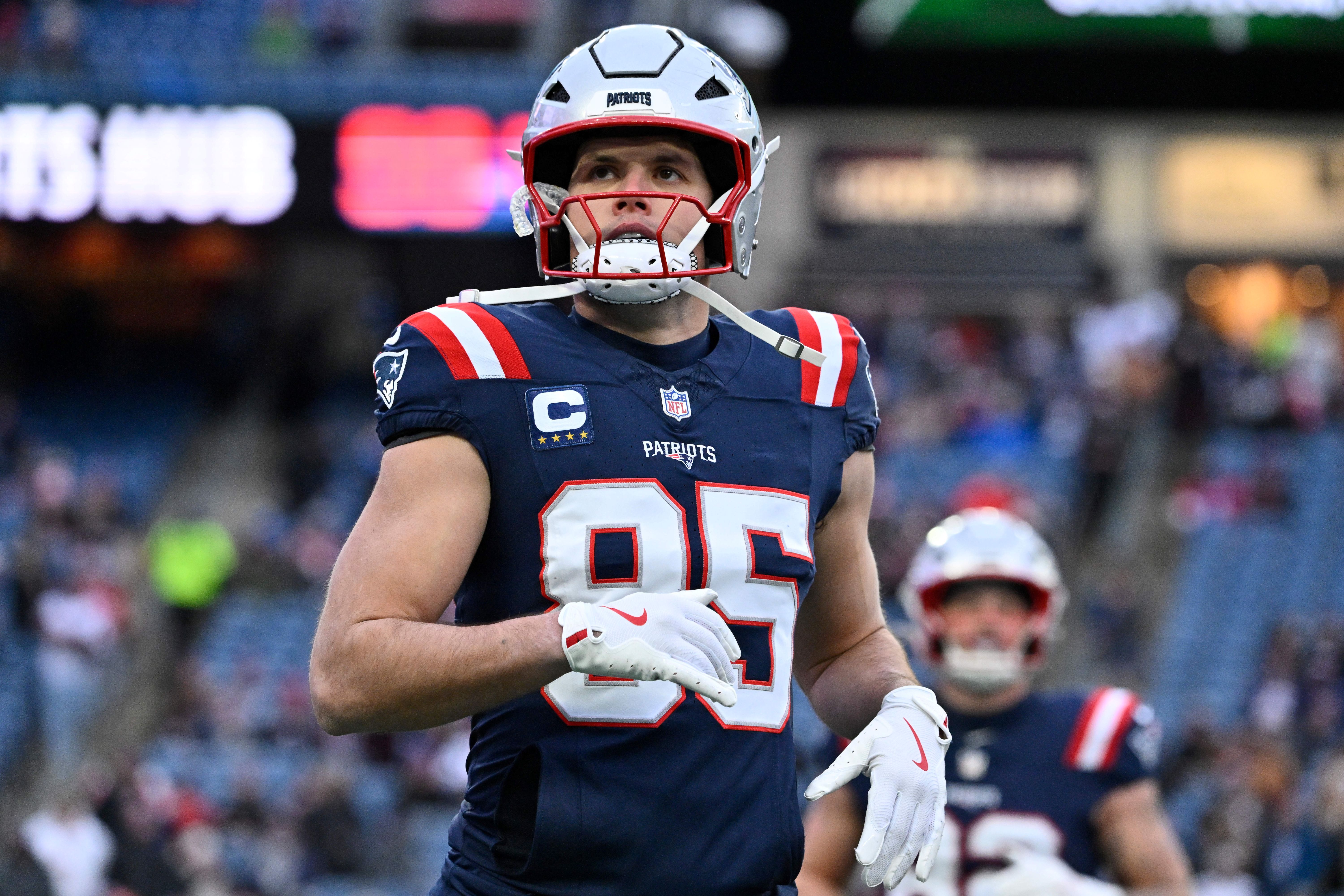 New England Patriots tight end Hunter Henry looks on as we dive into our Patriots vs. Broncos predictions.