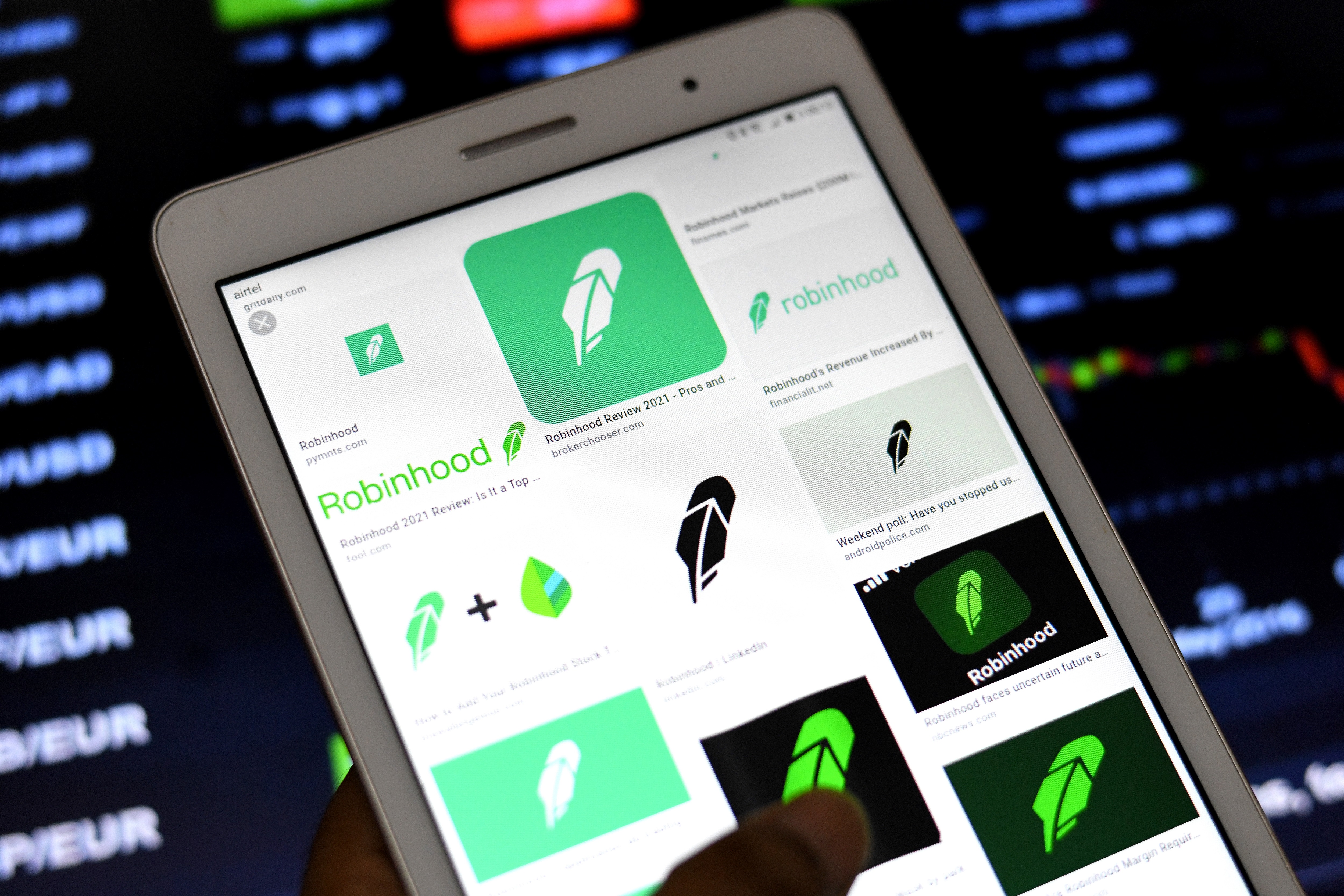 Robinhood logos are displayed as we look at the lawsuit against Kalshi and Robinhood in California. 