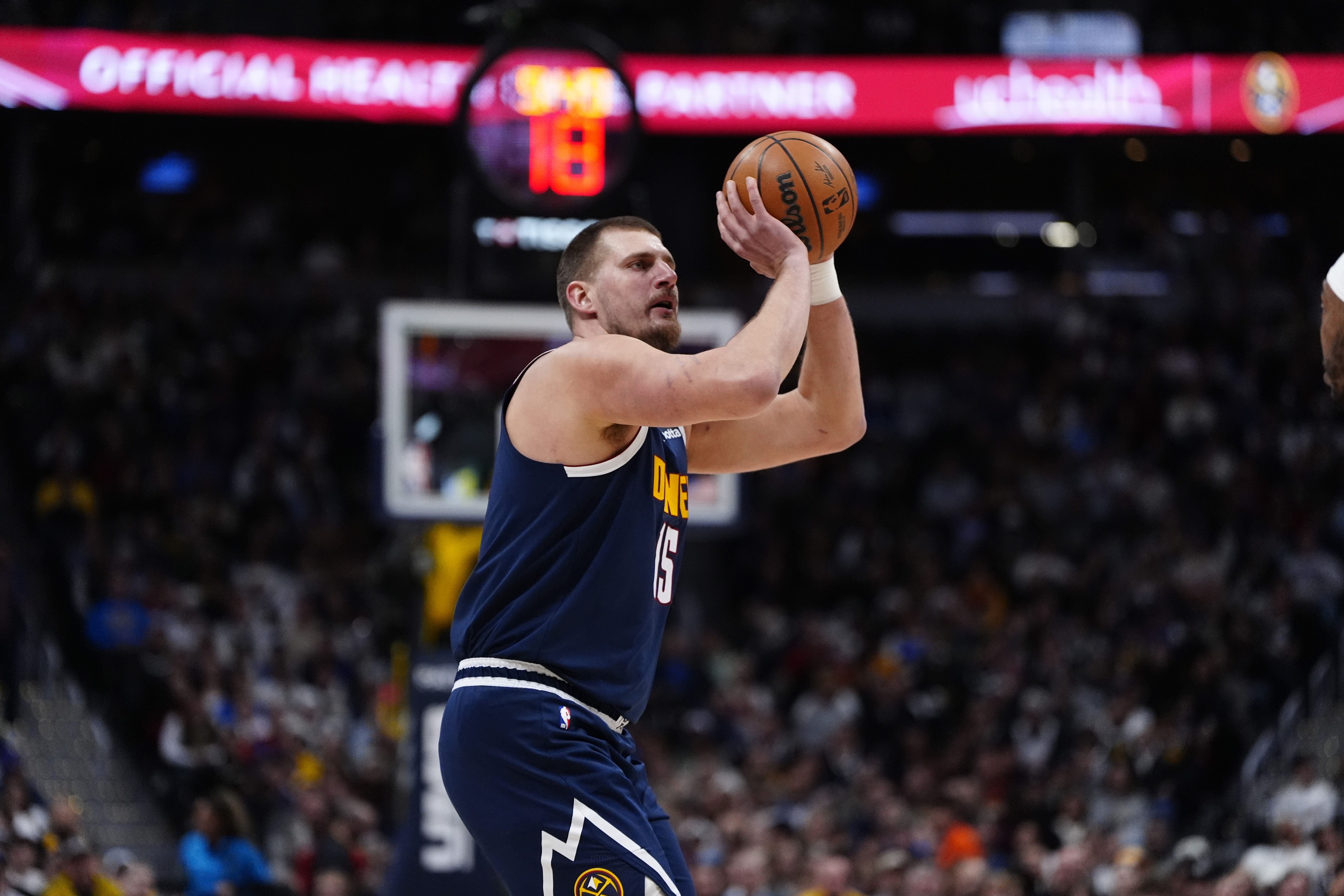 Denver Nuggets center Nikola Jokic (15) lines up a shot as we dive into our Timberwolves vs. Nuggets same-game parlay for Christmas Day.