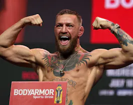 Conor McGregor poses during weigh-in for UFC 264 and we look ahead to our top odds for McGregor vs. Chandler.