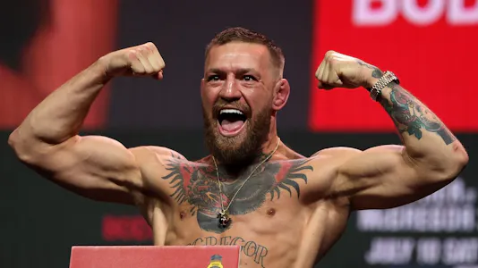 Conor McGregor poses during weigh-in for UFC 264 and we look ahead to our top odds for McGregor vs. Chandler.