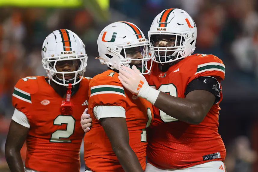 Miami Hurricanes quarterback Cam Ward (1) celebrates as we offer our college football Week 6 predictions.