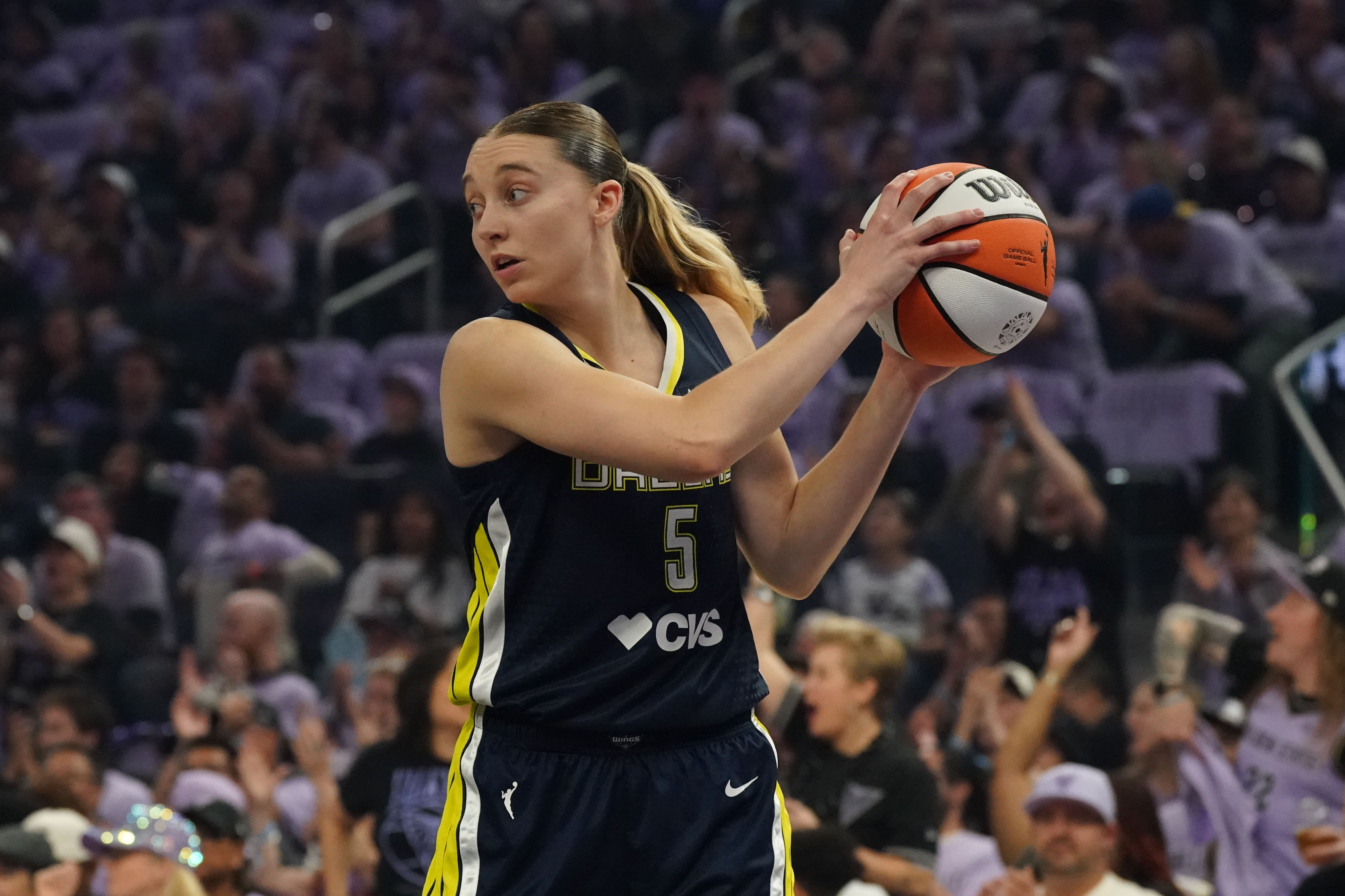 Wings guard Paige Bueckers (5) controls the ball as we break down our Wings vs. Valkyries prediction.