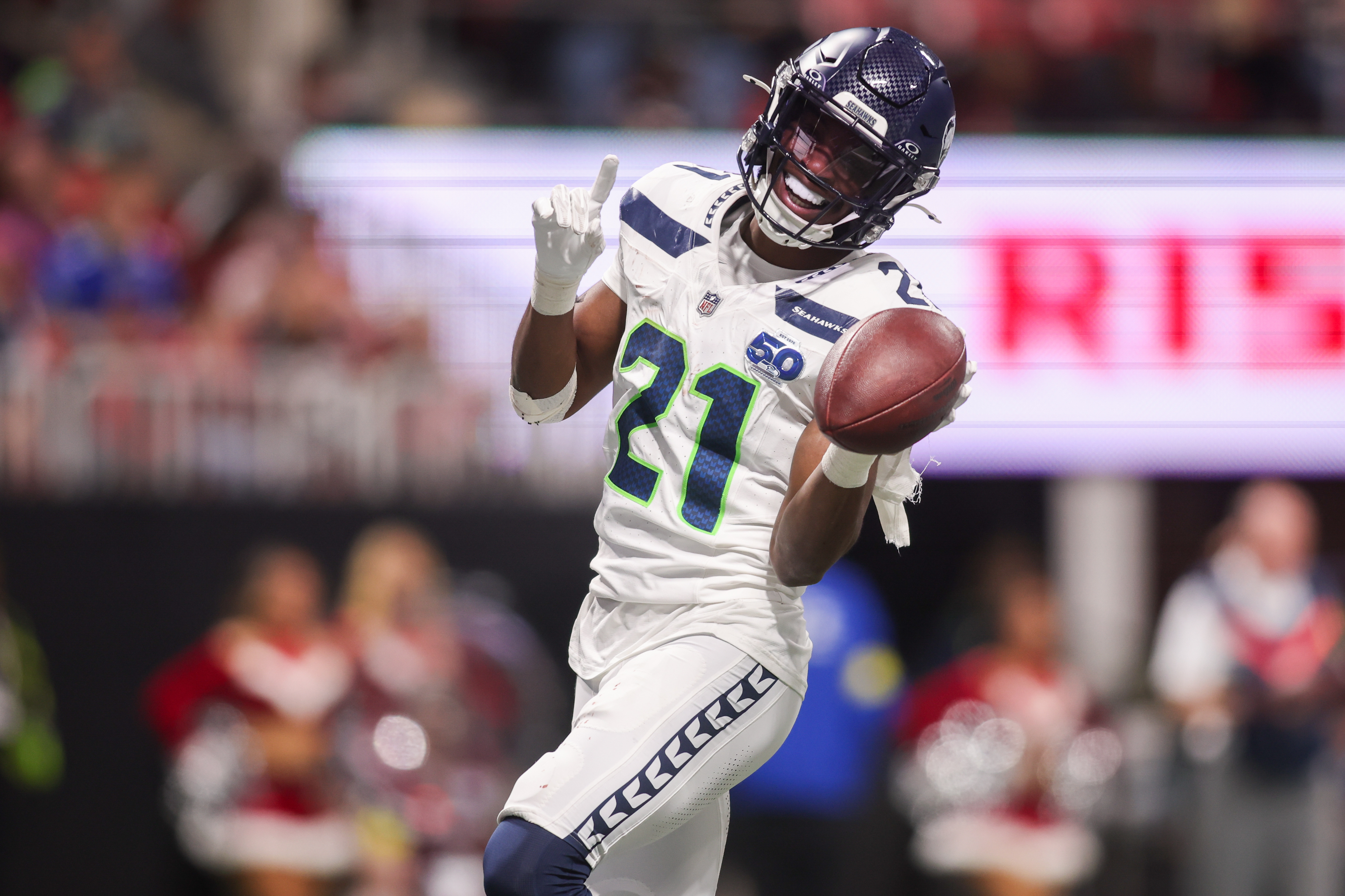 Seattle Seahawks cornerback Devon Witherspoon celebrates as we make our best Rams vs. Seahawks prediction.