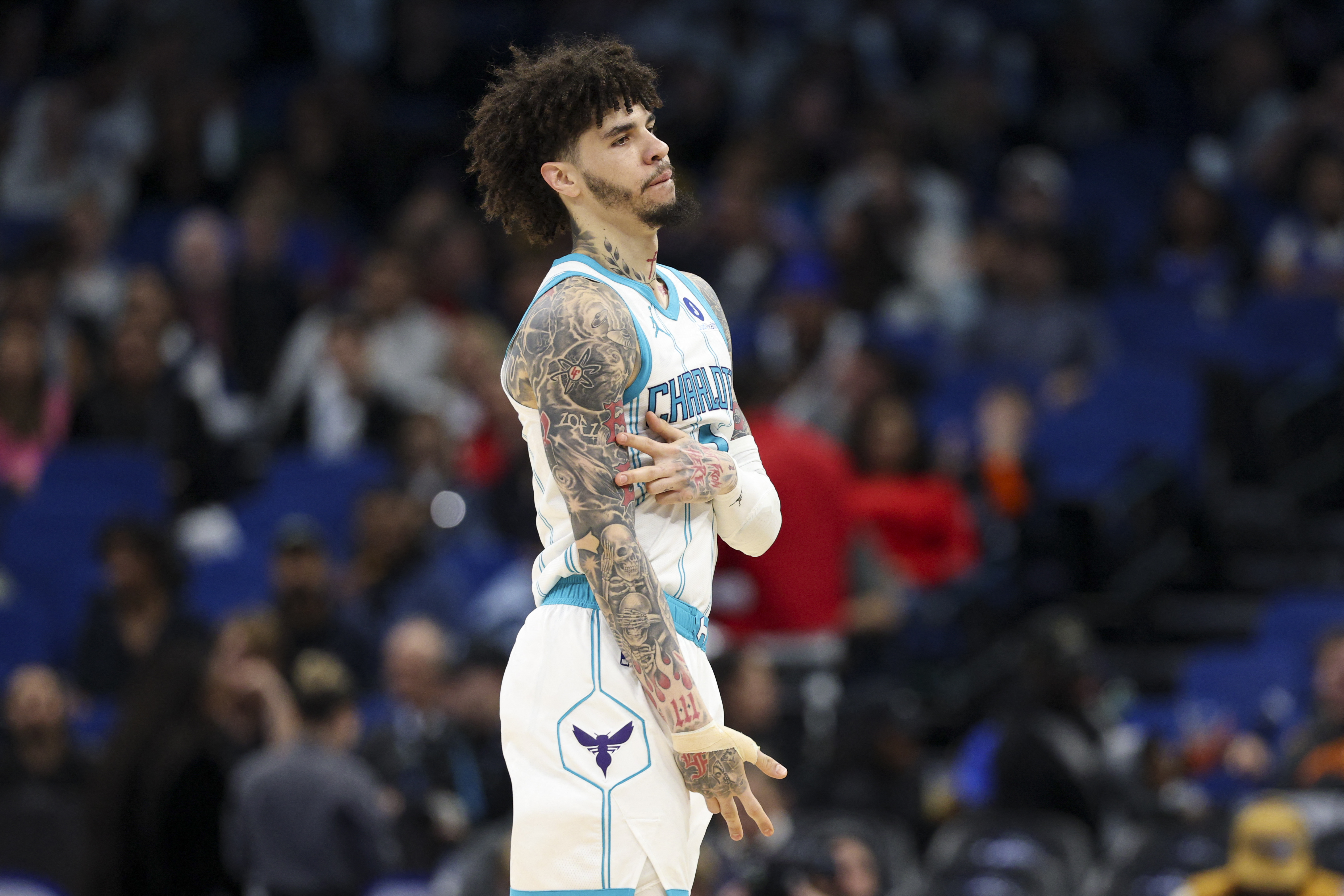 Charlotte Hornets guard LaMelo Ball (1), seen here reacting during a game, is featured in our Hornets vs. Magic prediction tonight.