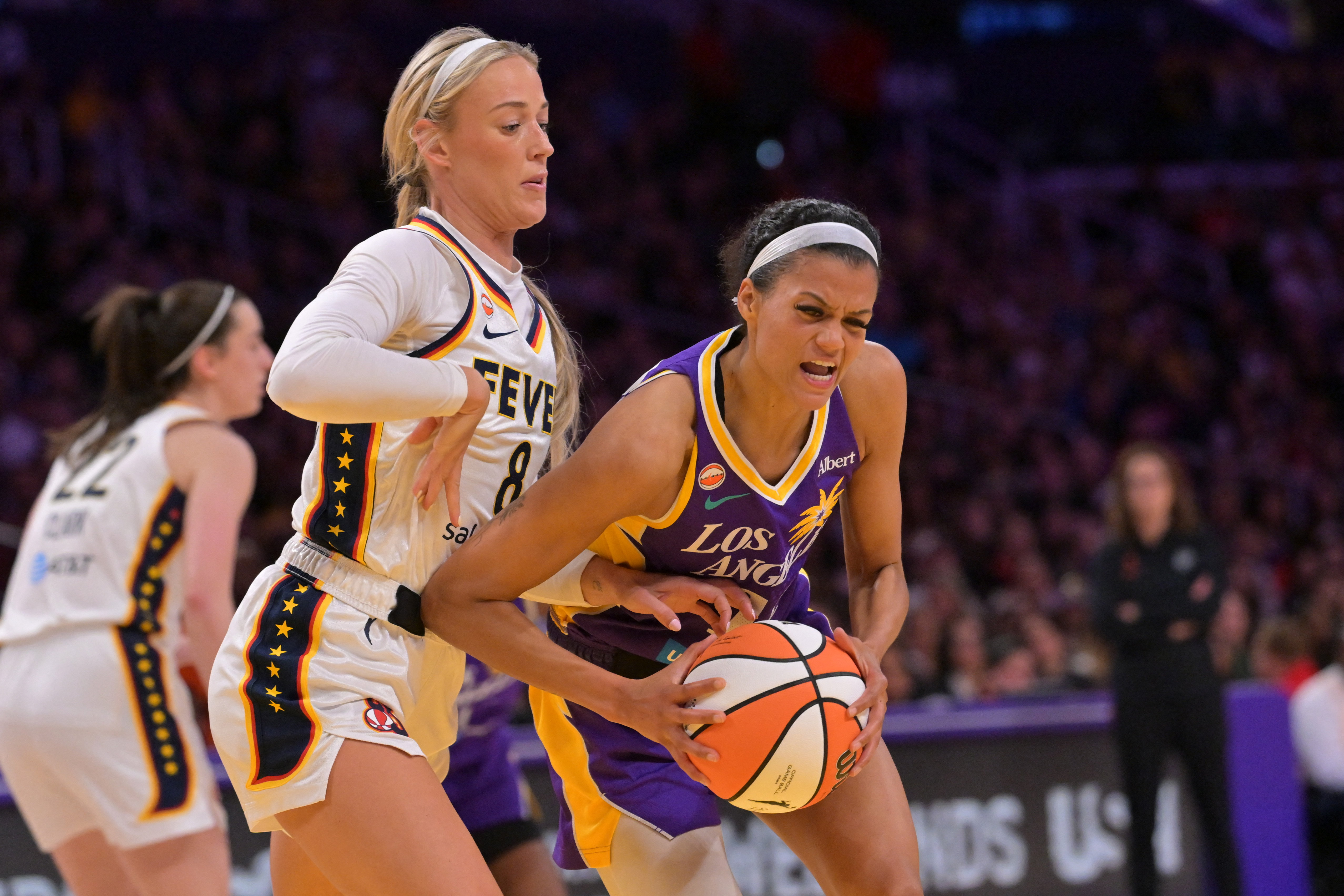 Indiana Fever guard Sophie Cunningham (8) defends Los Angeles Sparks guard Rae Burrell (12) as we break down our Sparks vs. Fever prediction.