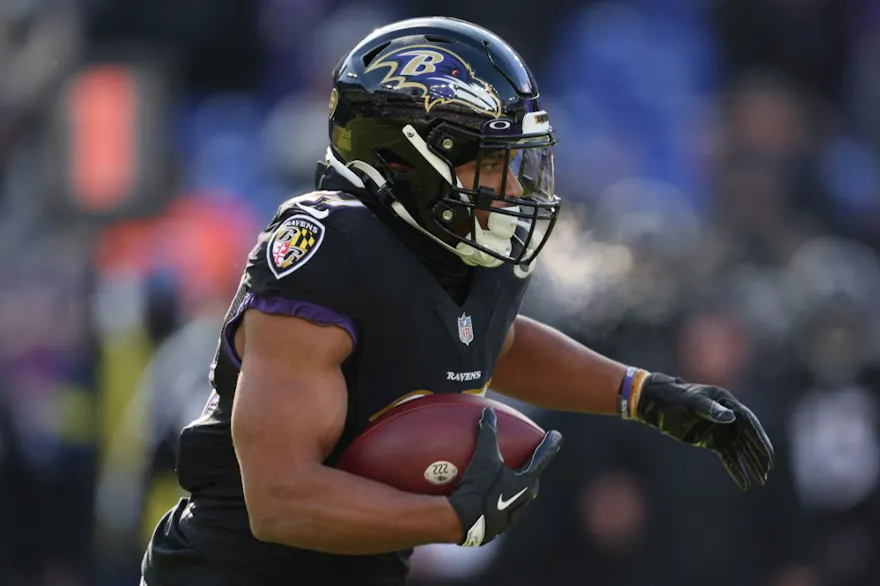 J.K. Dobbins of the Baltimore Ravens carries the ball against the Atlanta Falcons at M&T Bank Stadium on Dec. 24, 2022 in Baltimore, Maryland. 