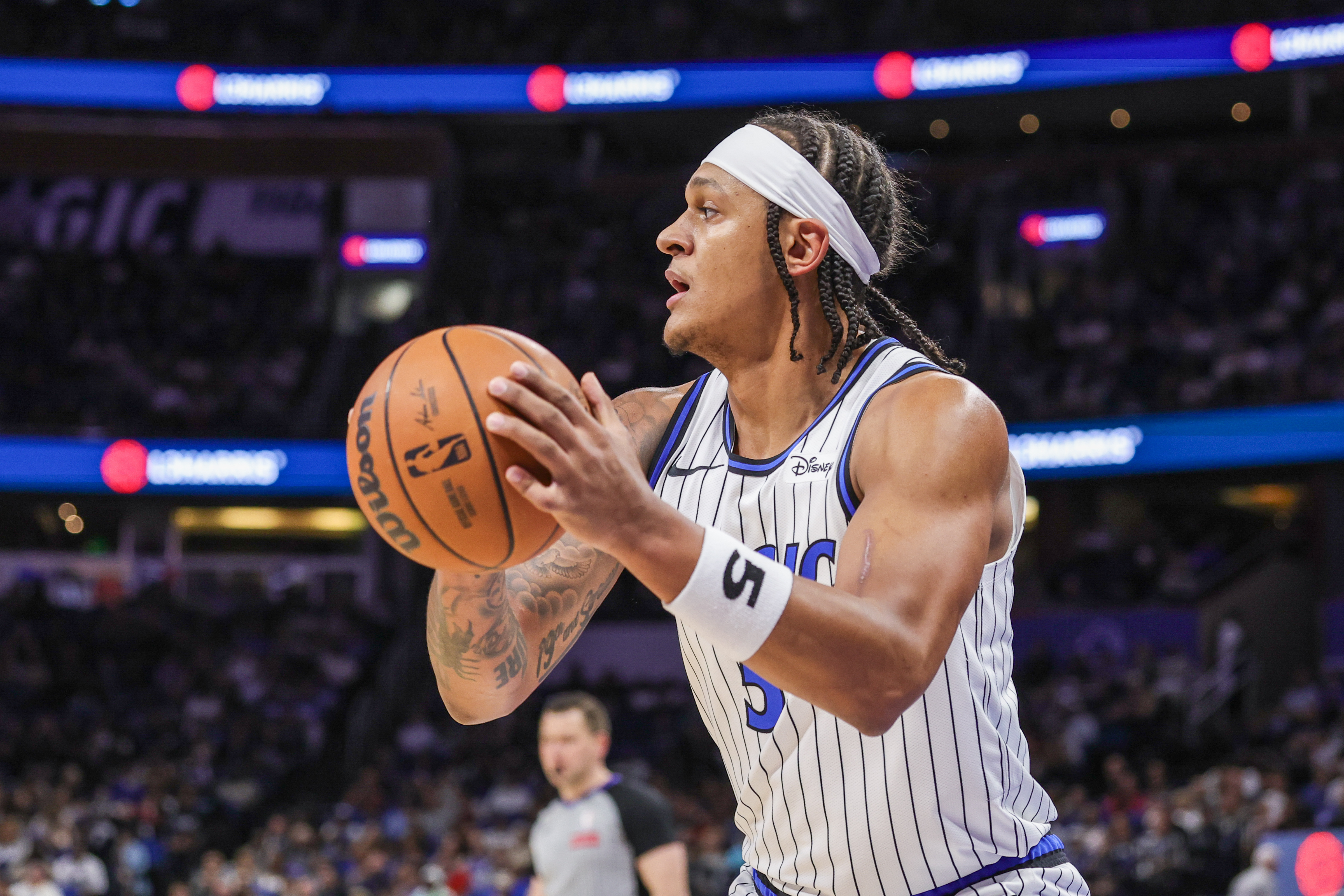 Orlando Magic forward Paolo Banchero (5), seen here looking to pass, is featured in our Magic vs. Suns player props today.