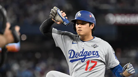 Los Angeles Dodgers designated hitter Shohei Ohtani - who's the focal point of my Shohei Ohtani player prop bets for Game 3 - celebrates after hitting a single.