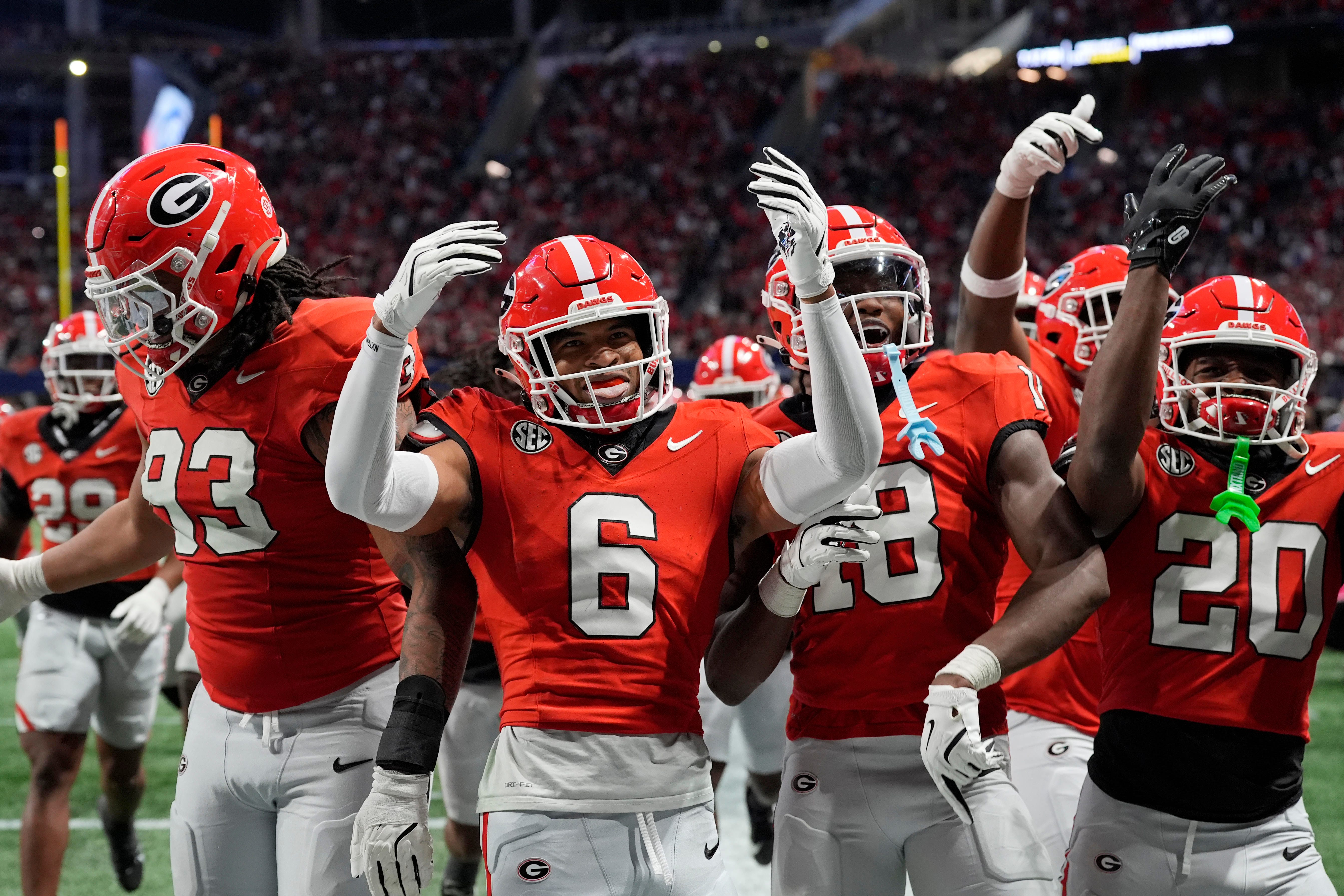 Georgia defensive back Daylen Everette celebrates with his teammates after picking off a pass as we make our Georgia vs. Notre Dame parlay picks ahead of the CFP Sugar Bowl.