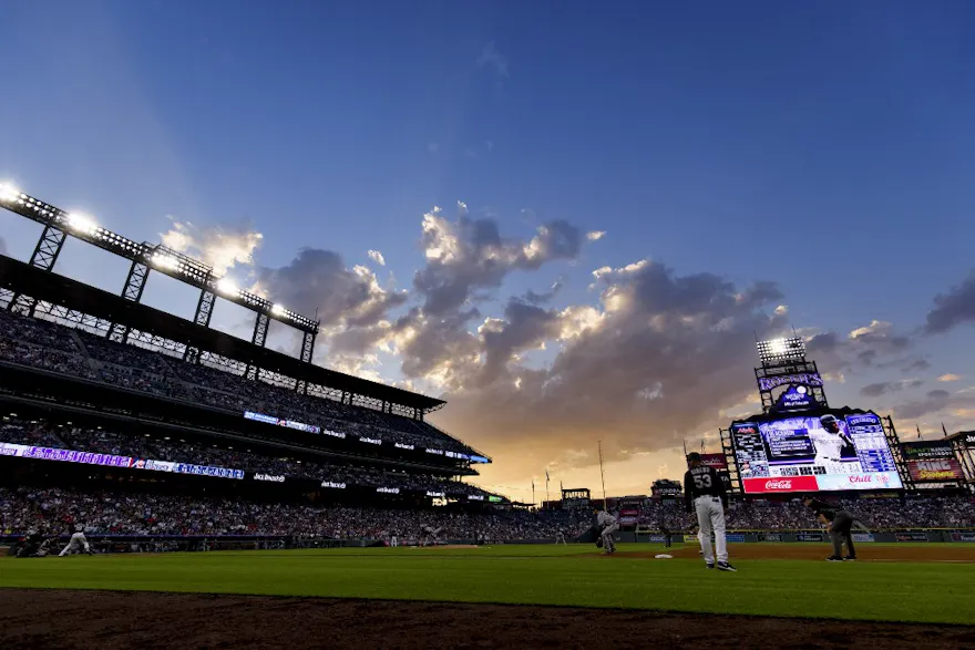 A general view of the stadium as the sun sets during the third inning of a game between the Colorado Rockies and the Atlanta Braves at Coors Field in Denver, Colorado. Photo by Justin Edmonds/Getty Images via AFP.