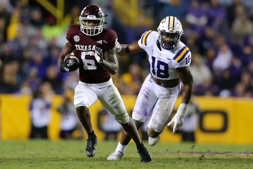 Devon Achane of the Texas A&M Aggies runs with the ball at Tiger Stadium in Baton Rouge, Louisiana.