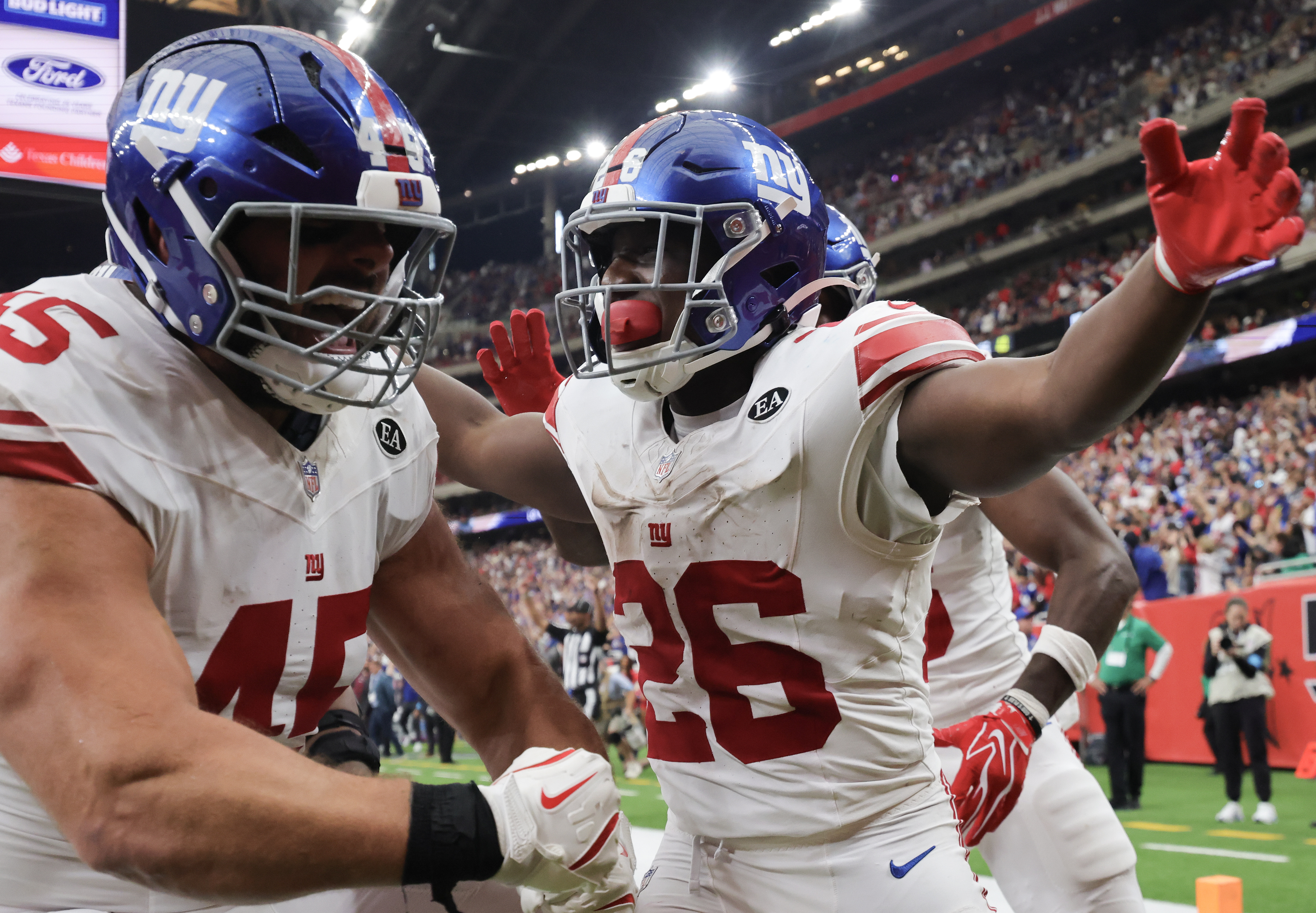 New York Giants running back Devin Singletary celebrates as we look at New York's record betting handle in September.