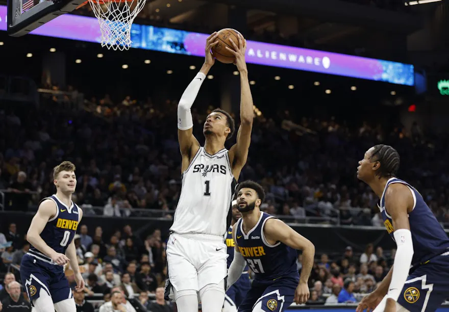 Victor Wembanyama of the San Antonio Spurs scores over Jamal Murray of the Denver Nuggets. We're expecting a big game from Wembanyama in our NBA player props and best bets.