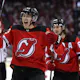 Jack Hughes and Luke Hughes of the New Jersey Devils celebrate teammate Damon Severson's goal during the second period in Game 3 of the second round.