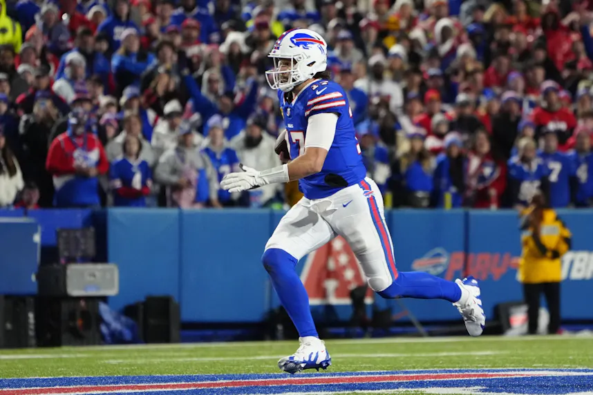 Buffalo Bills quarterback Josh Allen runs with the ball as we make our 49ers vs. Bills Week 13 Sunday Night Football (SNF) early picks.