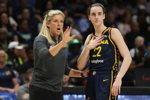 Caitlin Clark (22) of the Indiana Fever talks to head coach Christie Sides, as we offer our best Caitlin Clark odds and player props for Fever vs. Sun on Tuesday in Clark's WNBA debut.