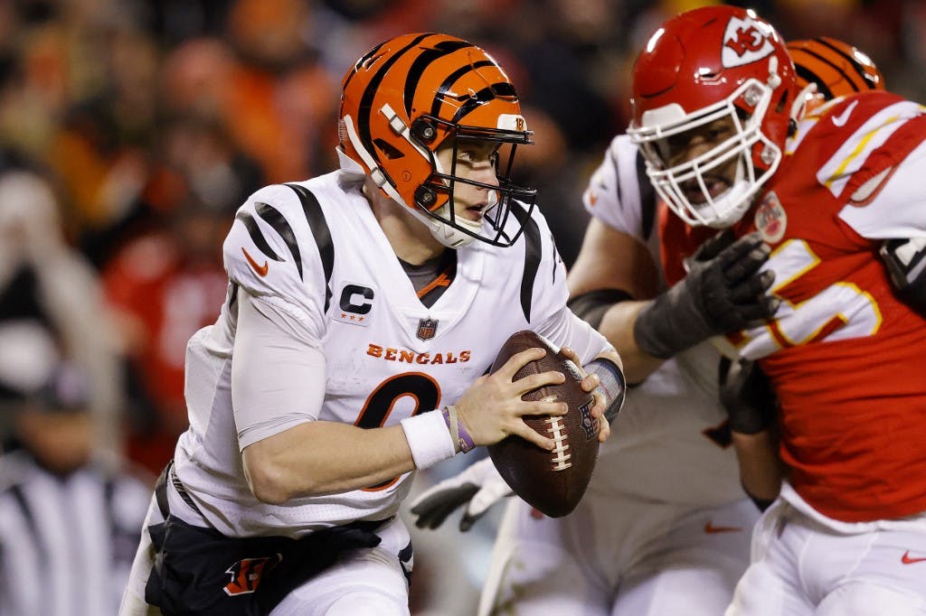 KANSAS CITY, MISSOURI - JANUARY 29: Joe Burrow #9 of the Cincinnati Bengals looks to pass against the Kansas City Chiefs during the fourth quarter in the AFC Championship Game at GEHA Field at Arrowhead Stadium on January 29, 2023 in Kansas City, Missouri.