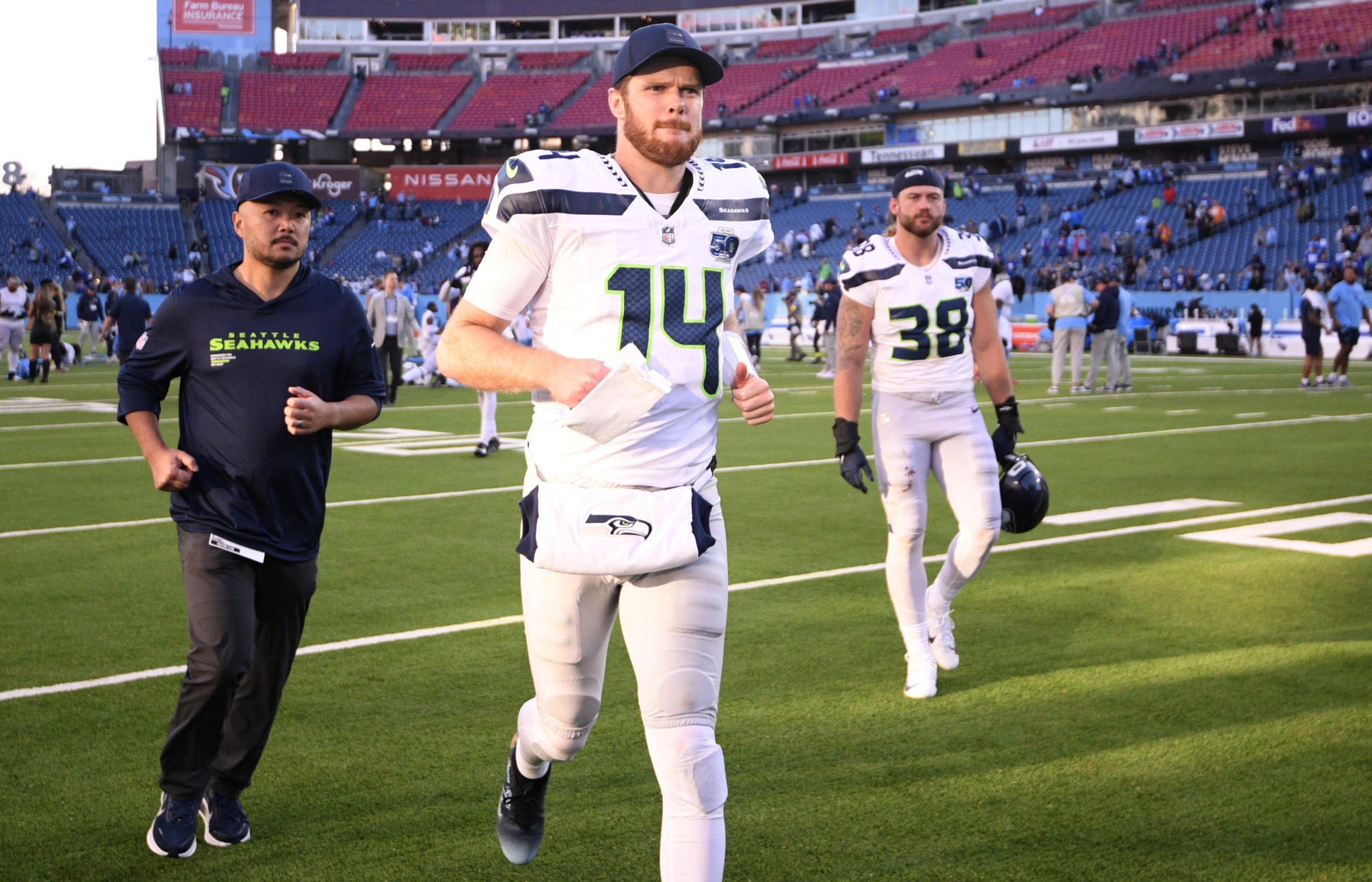 Seattle Seahawks quarterback Sam Darnold leaves the field after a game as we look at our NFL picks against the spread for Week 13