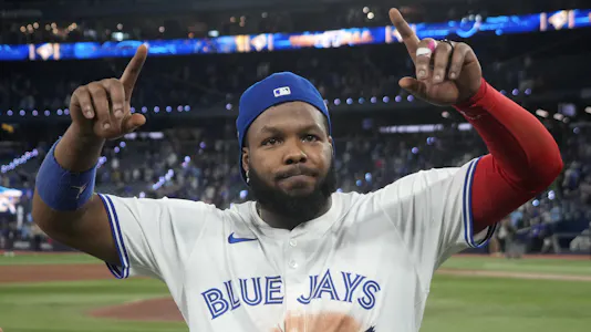 Toronto Blue Jays first baseman Vladimir Guerrero Jr. (27) celebrates after a win, as we analyze the best Vladimir Guerrero Jr. player prop bets for Game 1 against the Dodgers tonight.