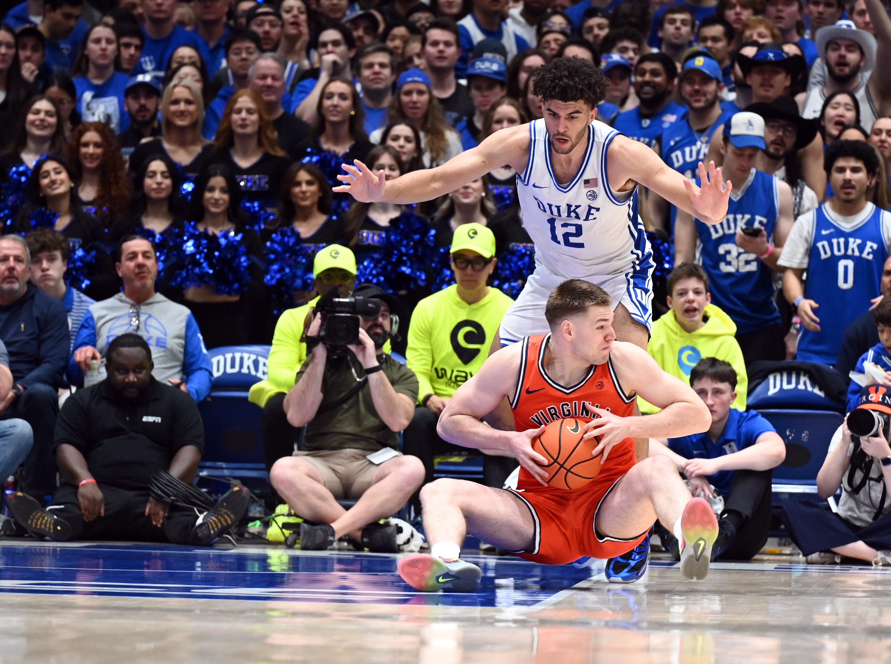 Duke's Cameron Boozer (12) and Virginia's Thijs De Ridder (28) square off in the ACC Championship tonight, one of 31 tournaments highlighted in our college basketball conference tournament guide.