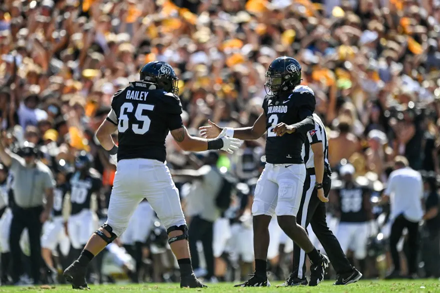 Quarterback Shedeur Sanders of the Colorado Buffaloes celebrates as we look at the best Colorado State vs. Colorado odds.