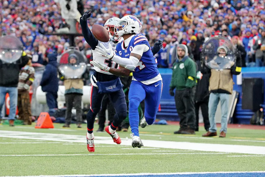 Stefon Diggs of the Buffalo Bills caches a touchdown pass over Jonathan Jones of the New England Patriots at Highmark Stadium on Jan. 08, 2023 in Orchard Park, New York.