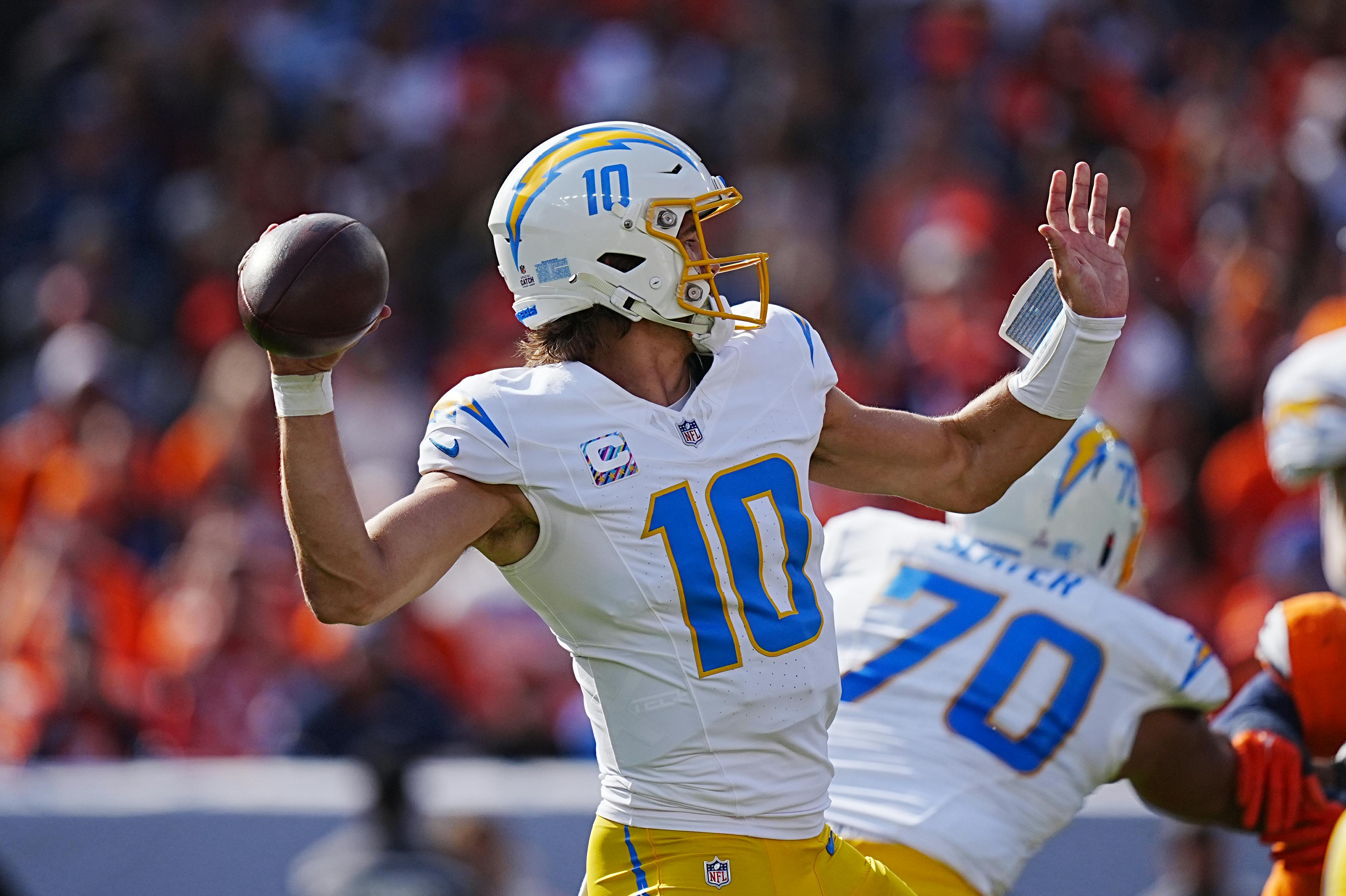 Los Angeles Chargers quarterback Justin Herbert prepares to pass as we offer our NFL Week 8 odds and predictions.