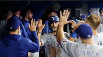 Evan Carter of the Texas Rangers celebrates scoring a run on a single off the bat of Travis Jankowski in the ninth inning against the Toronto Blue Jays as we look at our 2024 Rookie of the Year odds.