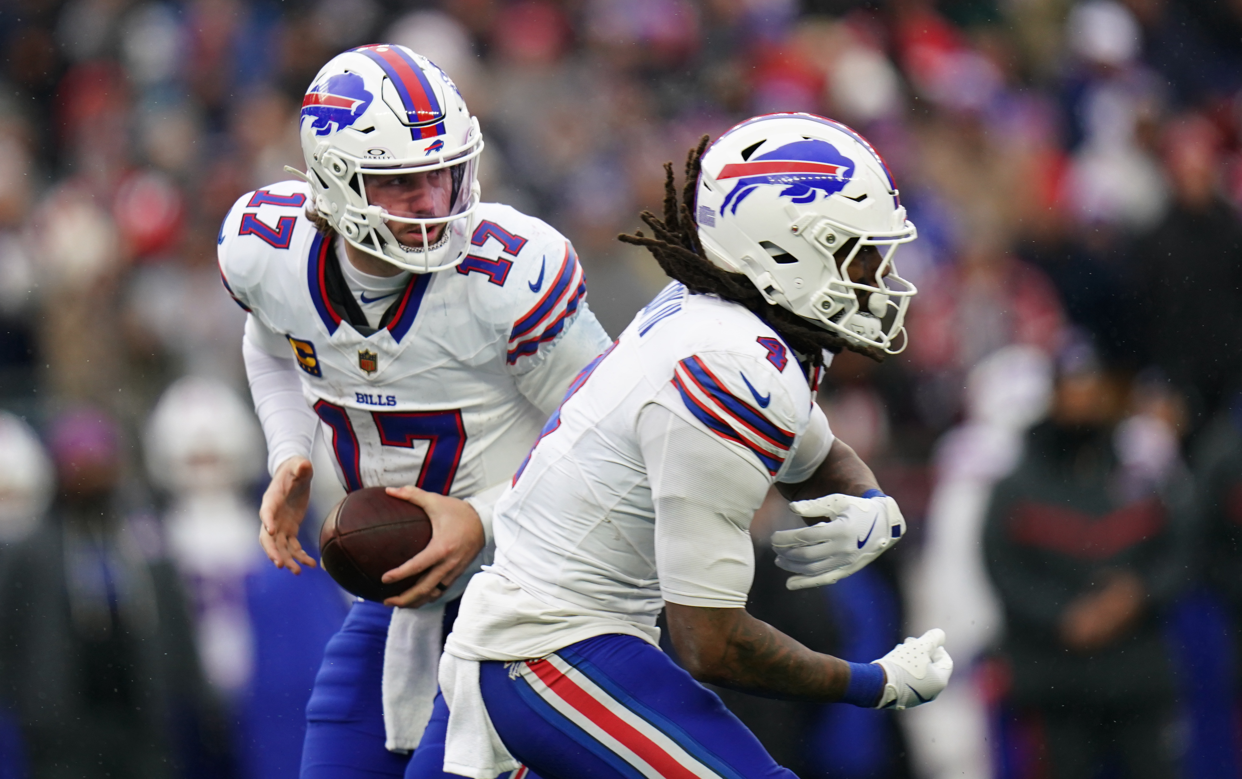 Buffalo Bills quarterback Josh Allen (17) fakes the hand off to running back James Cook III (4) as we break down our  Bills vs. Broncos predictions.