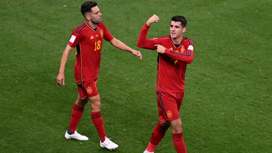 Spain's forward Alvaro Morata celebrates with teammates after scoring his team's first goal against Germany.