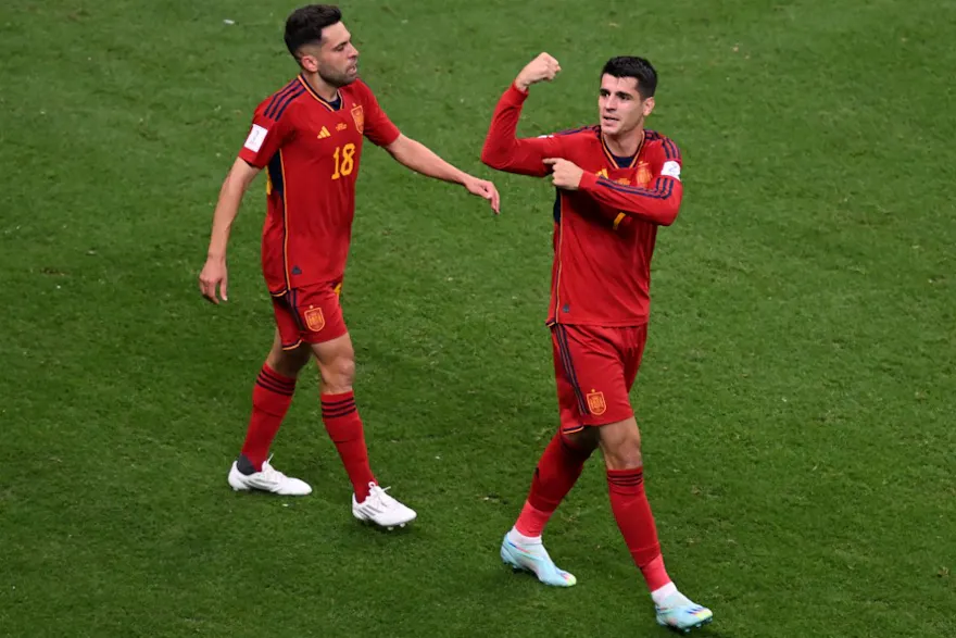 Spain's forward Alvaro Morata celebrates with teammates after scoring his team's first goal against Germany.