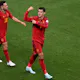 Spain's forward Alvaro Morata celebrates with teammates after scoring his team's first goal against Germany.