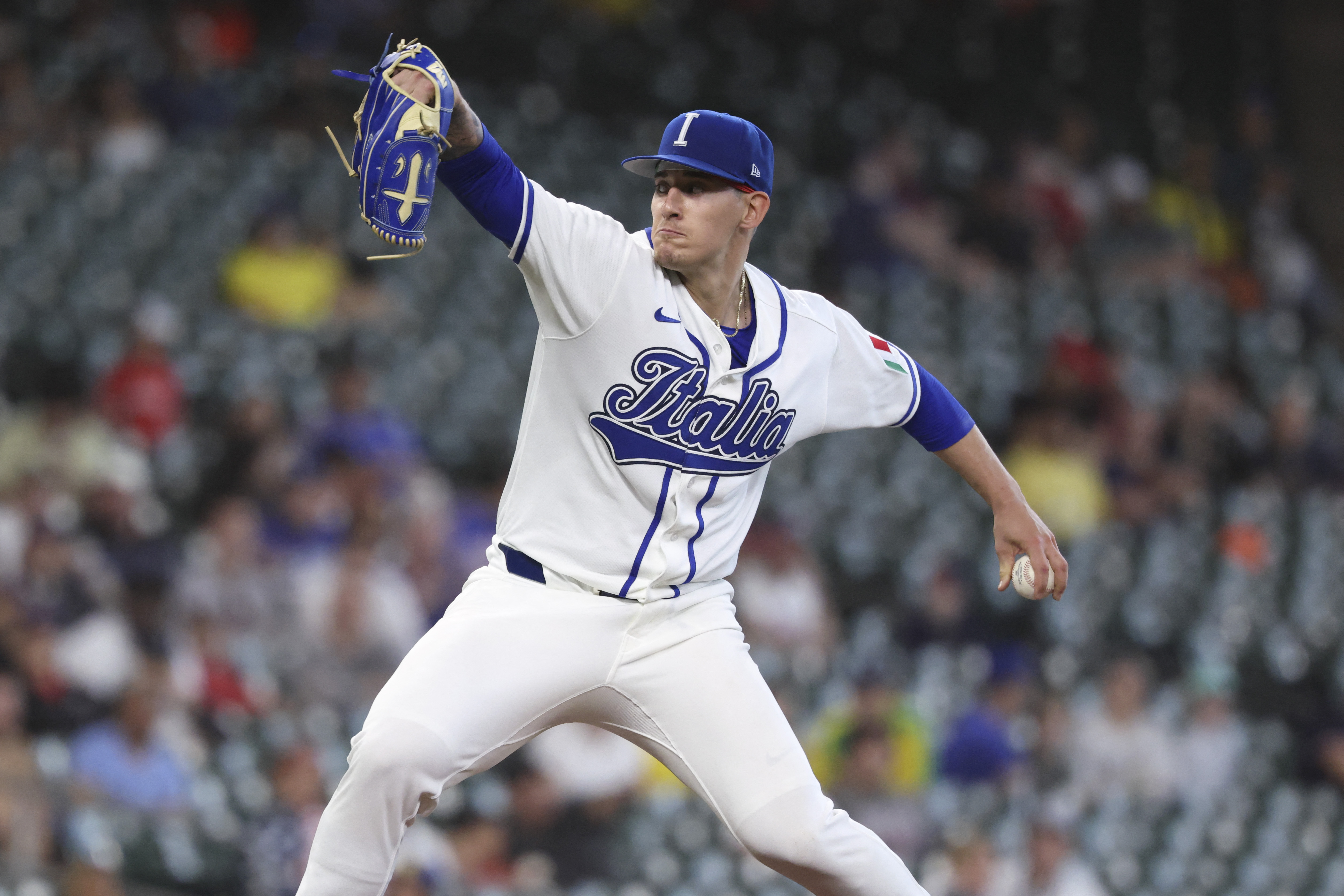 Italy starting pitcher Sam Aldegheri delivers a pitch as we make our best Italy vs. Puerto Rico prediction.
