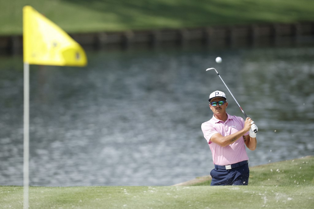 Rickie Fowler plays a shot from a bunker as we look at the best Players Championship odds boosts.