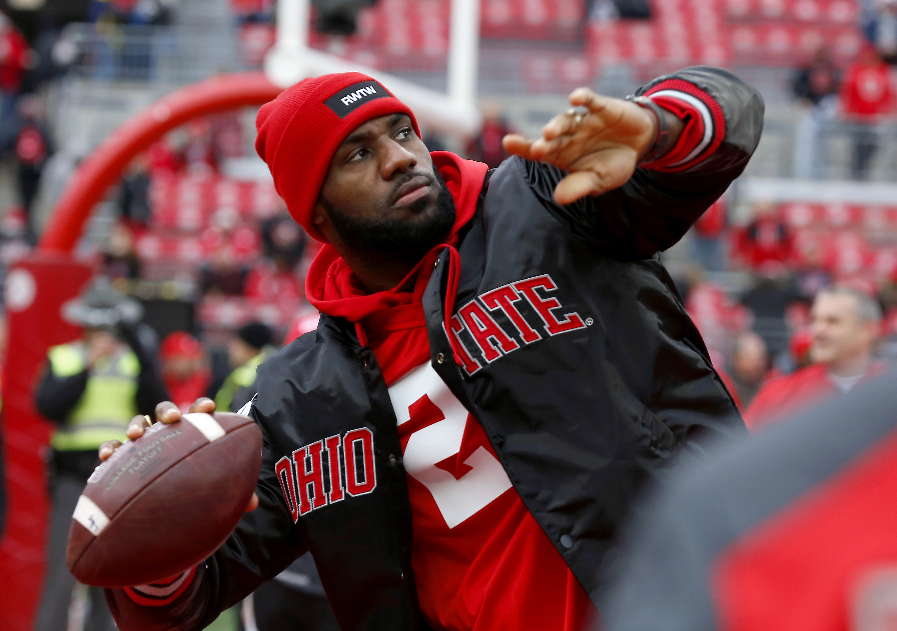 LeBron James plays catch with the Ohio State Buckeyes team before the game against the Michigan Wolverines at Ohio Stadium.