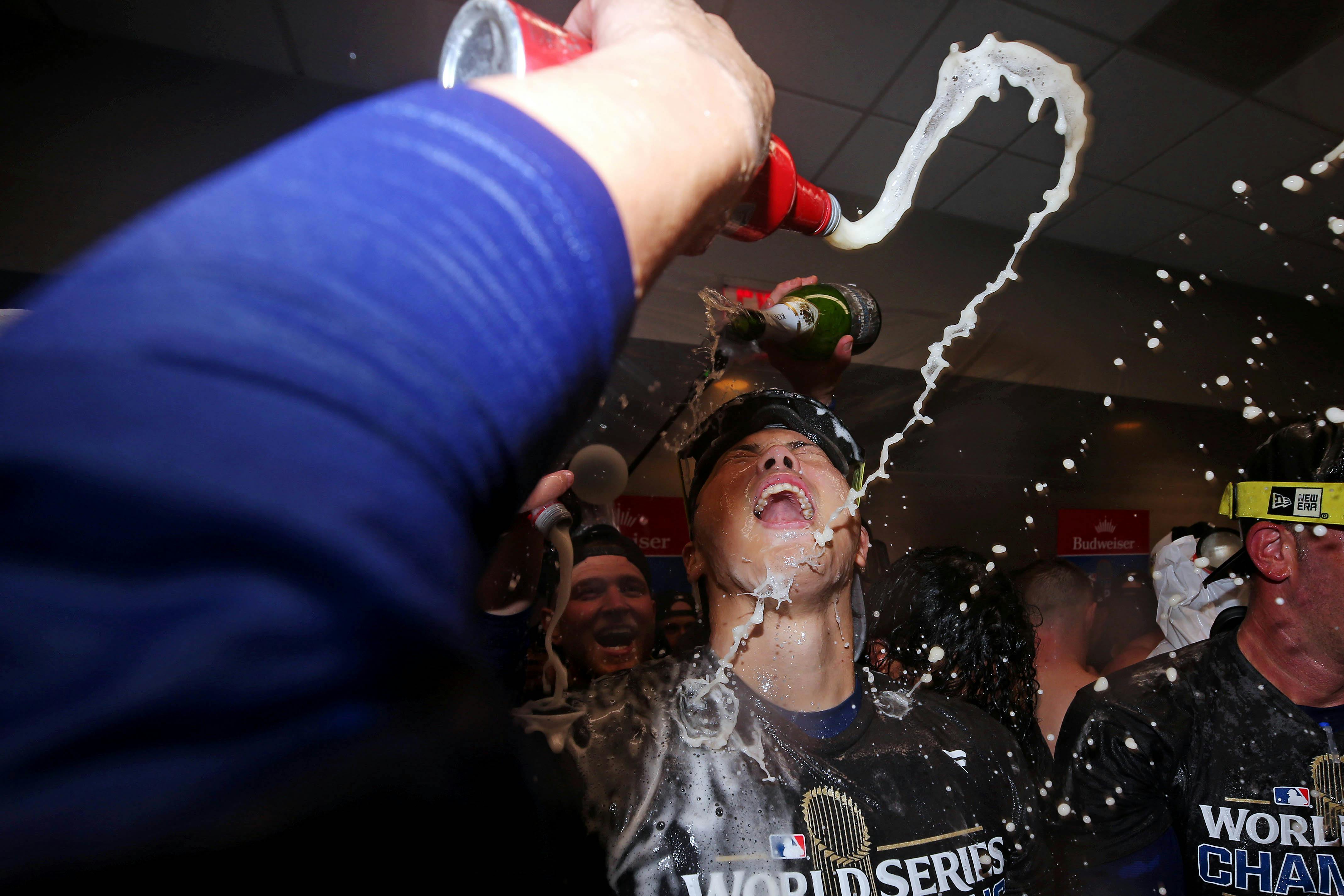 Los Angeles Dodgers two-way player Shohei Ohtani (17) celebrates in the locker room as we look at our 2025 championship parlay picks.