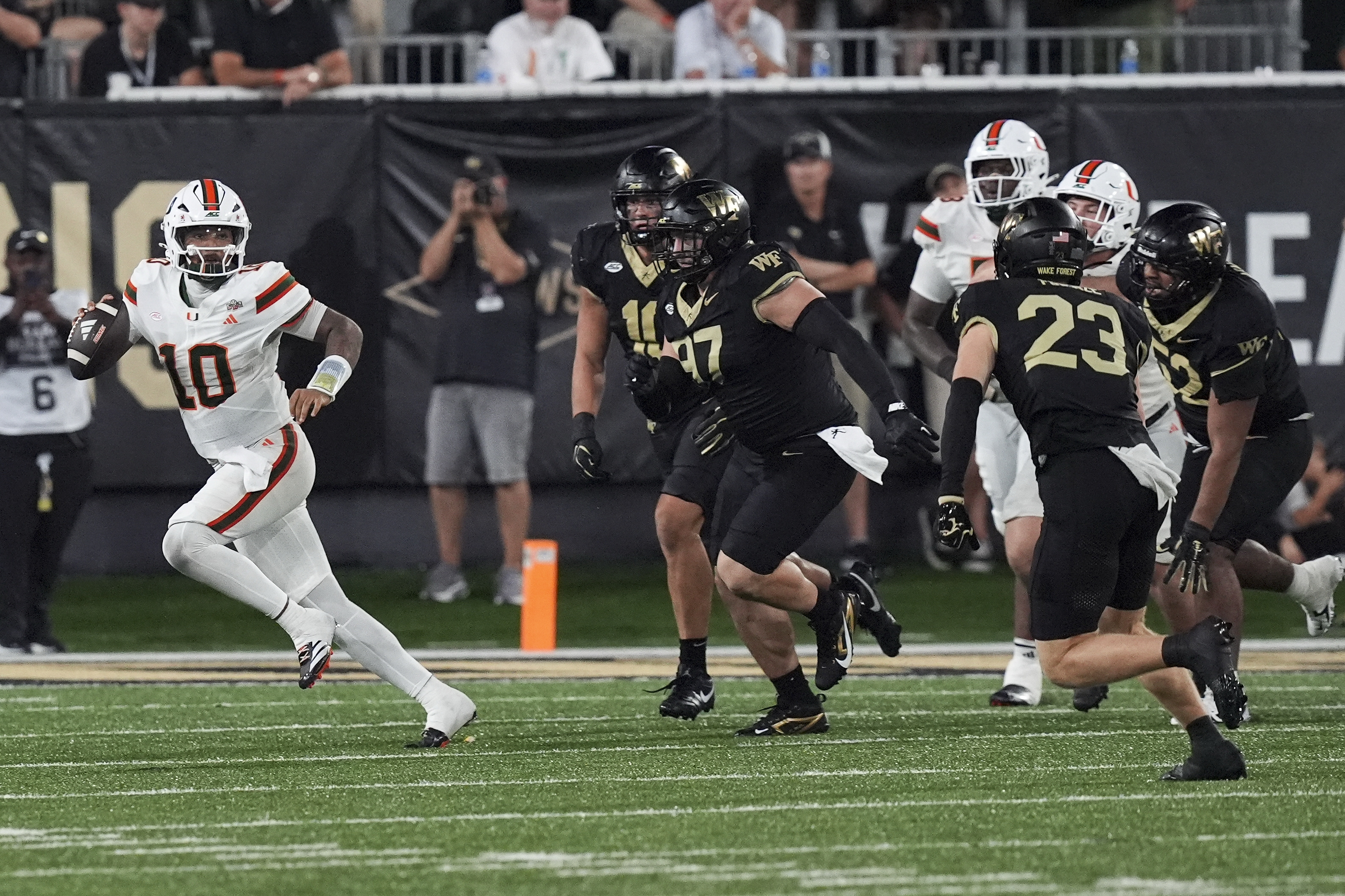 Pictured: Hurricanes quarterback Darian Mensah in action as we break down our Florida State vs. Miami Prediction. Photo by Jim Dedmon-Imagn Images.