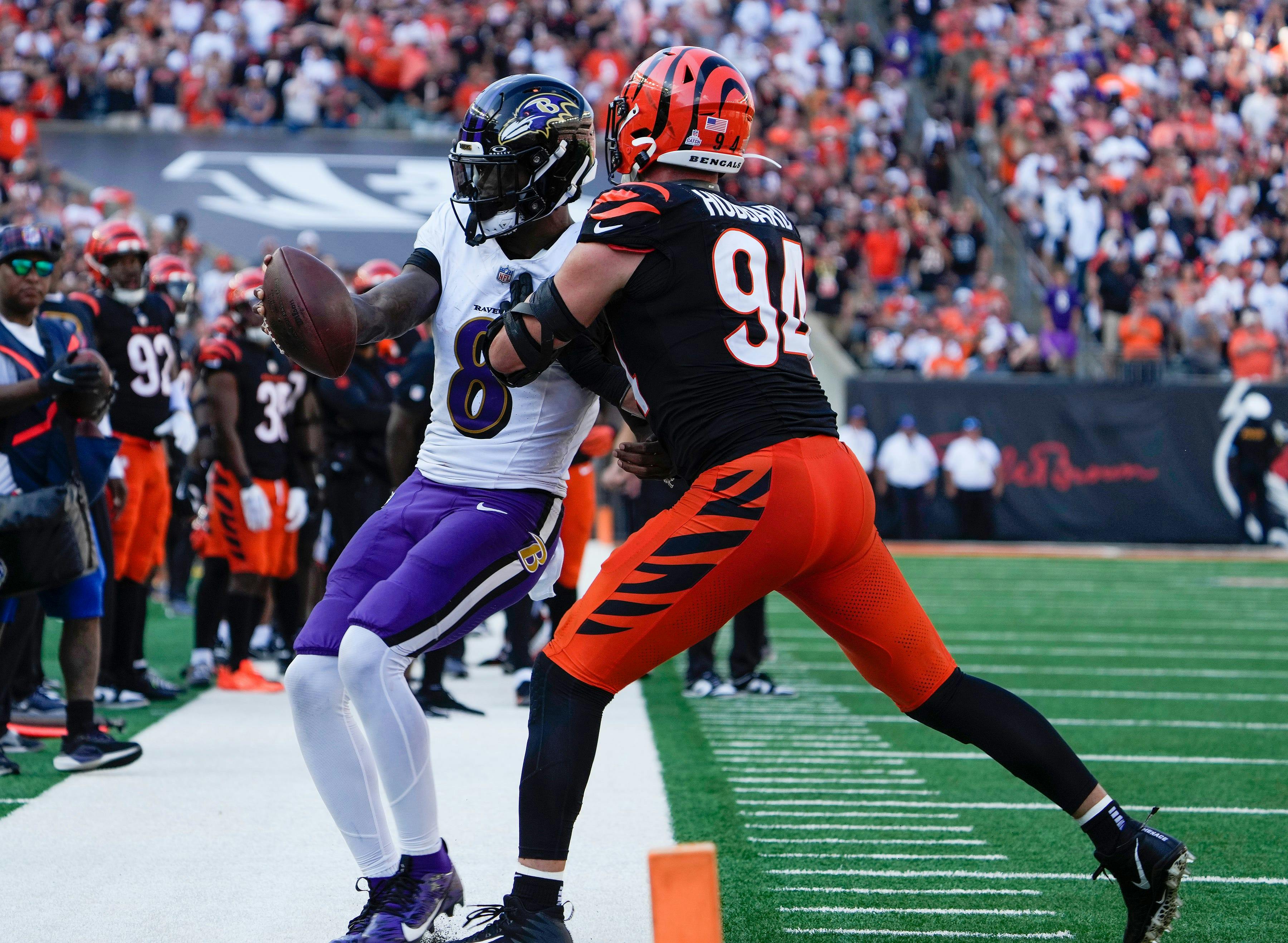 Cincinnati Bengals defensive end Sam Hubbard pushes Baltimore Ravens quarterback Lamar Jackson as we examine the NFL Week 10 predictions.