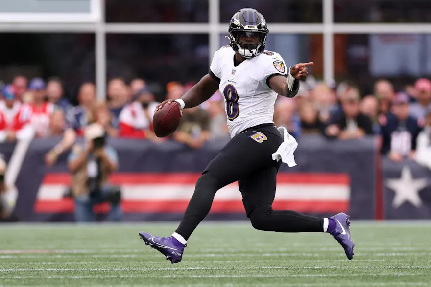 Lamar Jackson of the Baltimore Ravens carries the ball against the New England Patriots at Gillette Stadium on September 25, 2022 in Foxborough, Massachusetts.