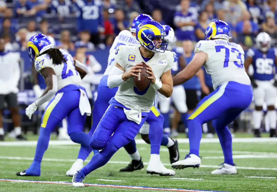 Quarterback Matthew Stafford of the Los Angeles Rams looks to make a pass play against the Indianapolis Colts in the first half of the game at Lucas Oil Stadium.