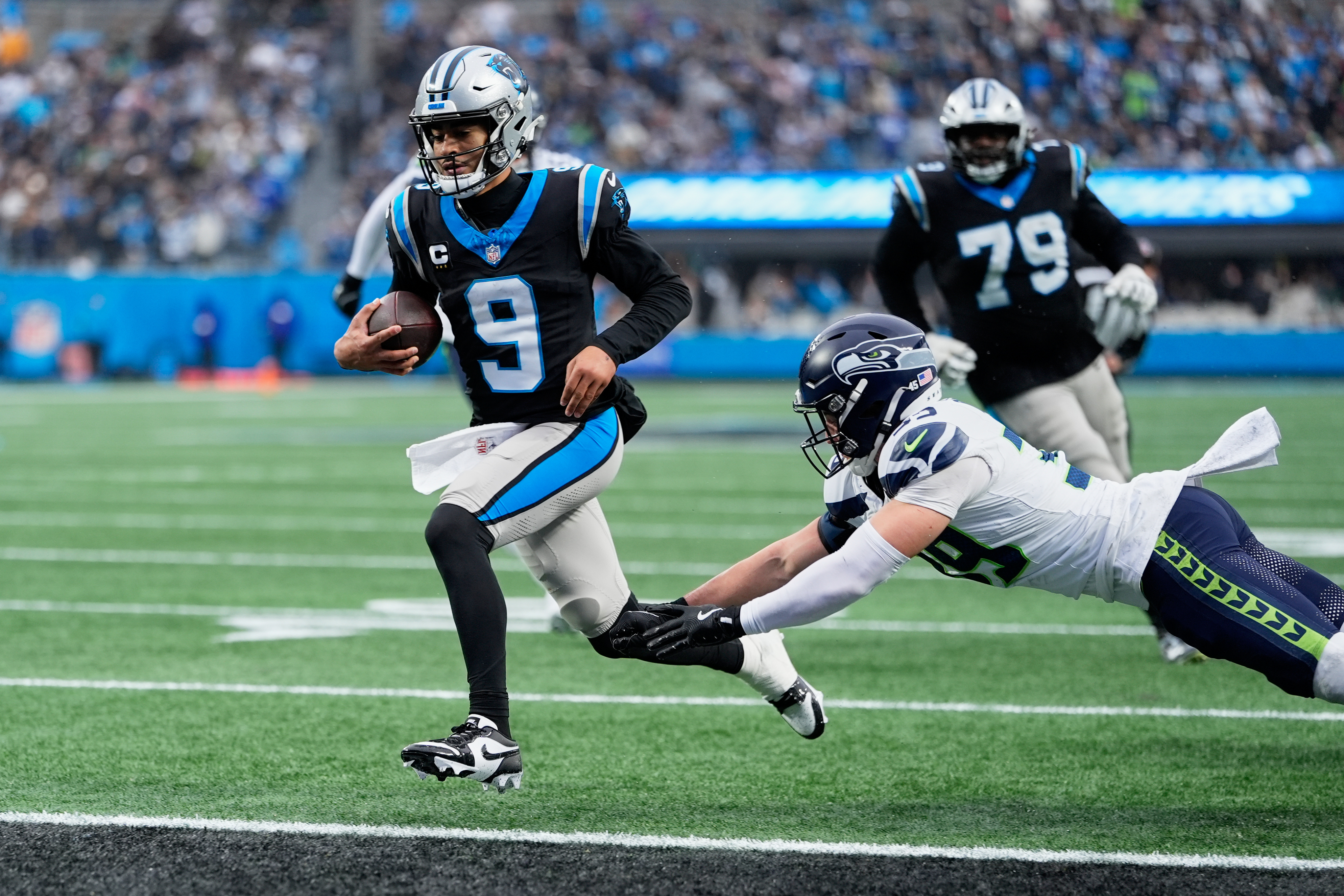 Carolina Panthers quarterback Bryce Young (9) scores as we break down our Panthers vs. Buccaneers predictions & odds.