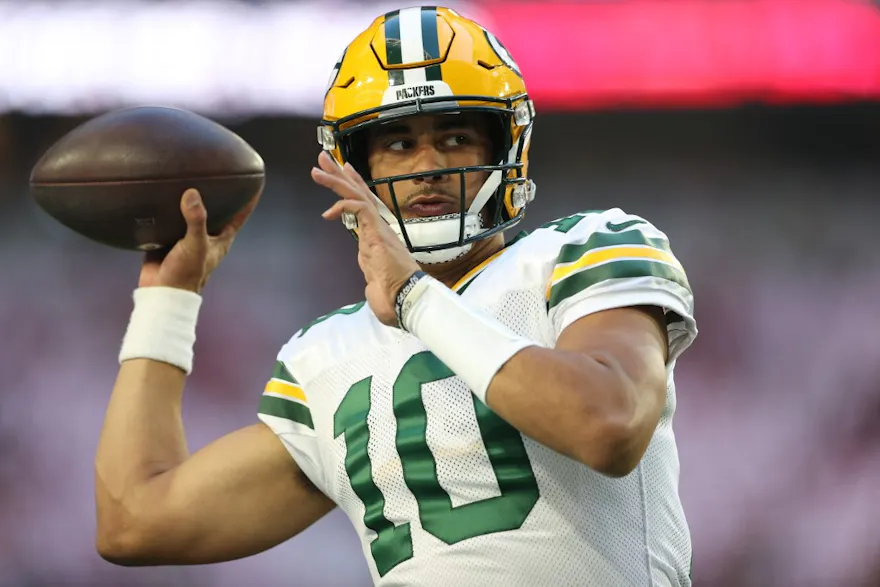 Quarterback Jordan Love of the Green Bay Packers warms up before the game against the Arizona Cardinals, and we offer new U.S. bettors our exclusive Caesars promo code.