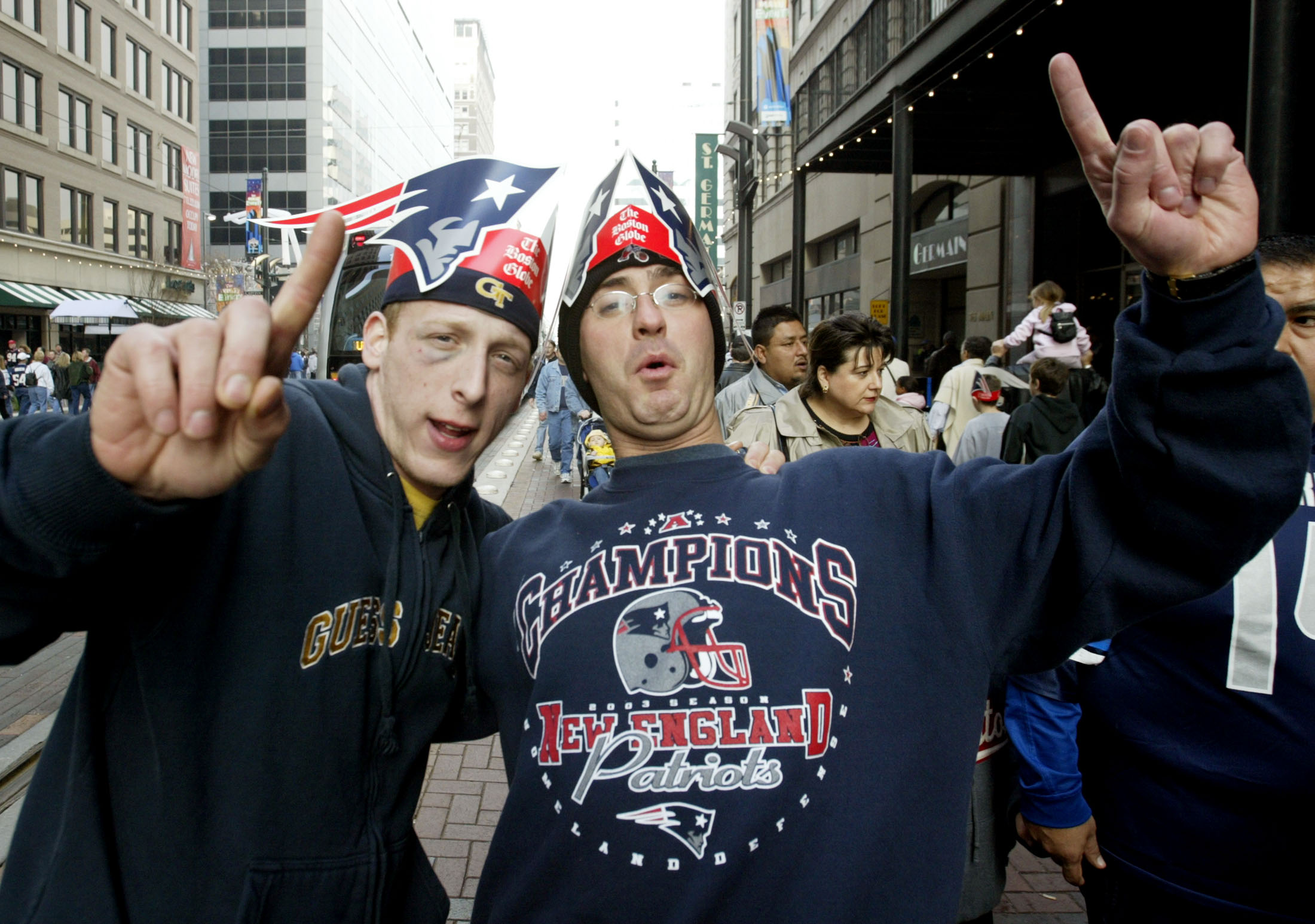 Patriots fans cheer at a street party as we look at how to get out of work on Monday after the Super Bowl.